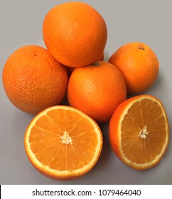 Some Naval Oranges Fruits On Grey Background