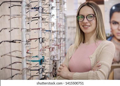 Some new look. Woman in optical shop.