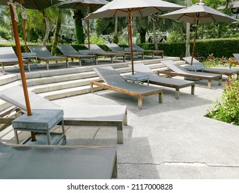 some outdoor daybeds with umbrellas