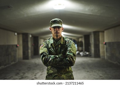 Some people are afraid of the dark, I welcome it. Shot of a young soldier standing outside on a cold night at a military academy. - Powered by Shutterstock