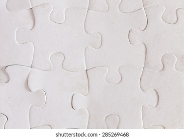 Some pieces of a white puzzle - Shutterstock ID 285269468