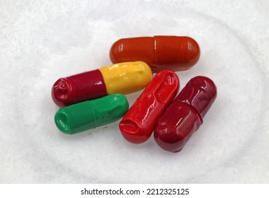 Some Pills Or Medicines Breaking Down On A Snowy Floor