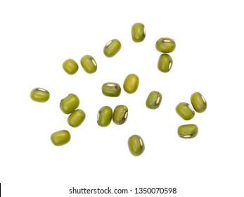 Some spread out green mung beans seen directly from above and isolated on white background