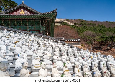 Some statues of he 500 Buddhaâs Disciples white statues by a temple hall in Bomunsa Temple on the island of Seongmodo, Ganghwa, Incheon, South Korea.