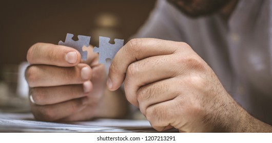 Some Things Just Go Together. Businessman With Puzzle In Hand. Focus On Hand. Concept. 