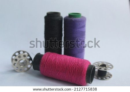some threads for sewing on a white background