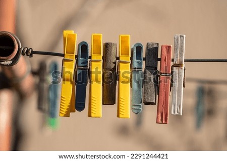 Some vintage clothes hangers. Colored clothes hangers hanging on a wire.