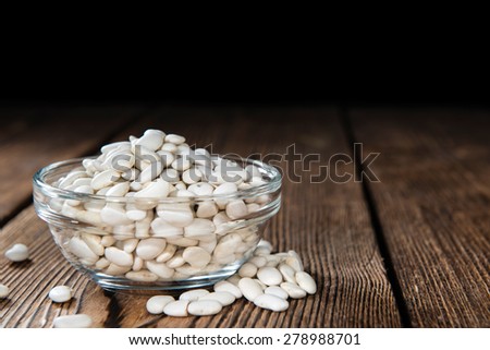 Some White Beans on a rustic wooden background (close-up shot) Stock foto © 