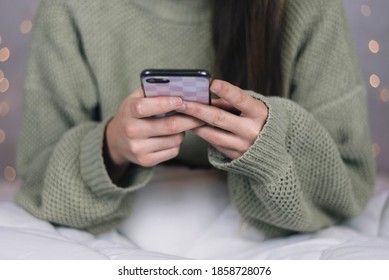 Somebody holding a mobile phone - Shutterstock ID 1858728076