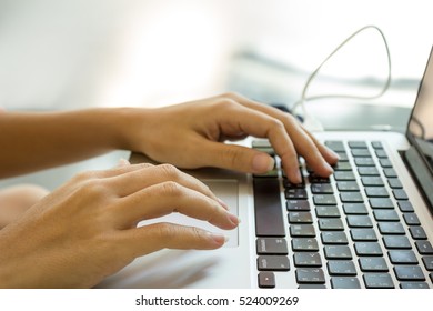 somebody working laptop computer near window with bright sunshine - Shutterstock ID 524009269