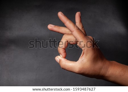 someone is demonstrating a flicking hand with a black background