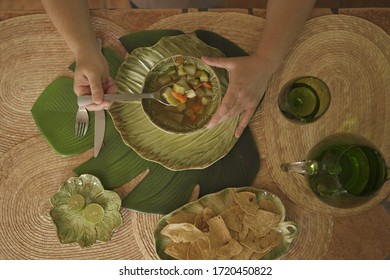 Someone Eating A Delicious Vegetable Soup