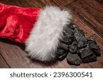 Someone is on the naughty list as a Christmas Stocking full of coal is spilling on floor