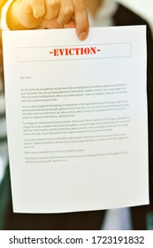 Someone Serving An Eviction Notice With Hands In View - Late Rent - Late Mortgage - Payment - Concept