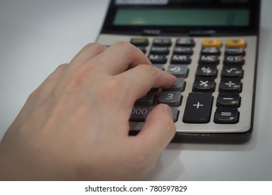 Someone Using A Calculator