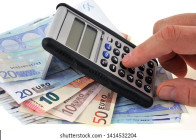 Someone Using A Calculator On Euro Banknotes In Close-up