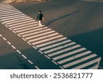 someone is walking on a zebra crossing in downtown Jakarta