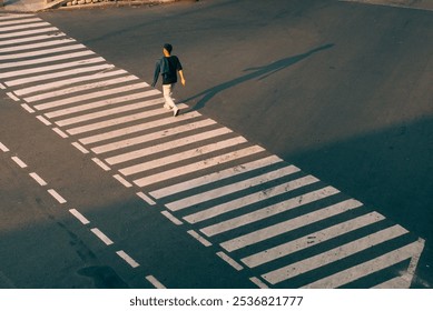 someone is walking on a zebra crossing in downtown Jakarta