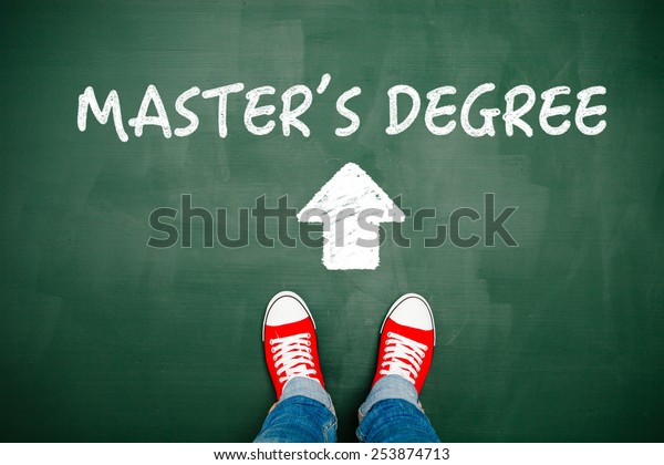 Someone wearing red sneakers heading towards his\
master\'s degree.