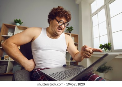 Someone's Wrong On The Internet. Funny Angry Man Points Finger At Laptop Screen. Aggressive Opponent, Online Fight, Discussing Politics, Disagreement, Computer Bug Error, Slow Wifi Connection Concept