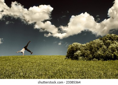 Somersault On Grass On The Sky Background