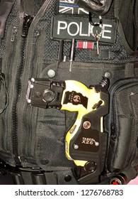 Somerset, UK - 18th January 2018: A British Police Officer With A Taser Gun, Conceptual Image