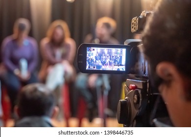 Somerville, MA - April 28 2019: Person Filming A Panel Discussion During An Event In Somerville, MA.