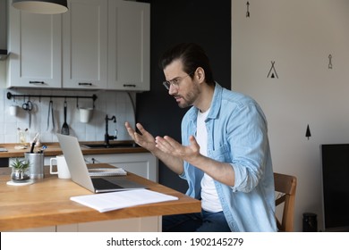 Something going wrong. Annoyed young man remote student feeling confused with too complicated work or bad understanding difficult question. Angry employee working from home losing data in pc crash