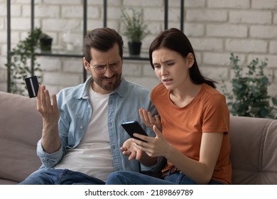 Something Wrong. Concerned Couple In Love Entering Incorrect Data From Bank Plastic Card While Making Payment Via Web App. Worried Young Spouses Unable To Pay Online Angry Of E-banking System