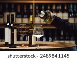 Sommelier Pouring Sparkling Wine in Cellar