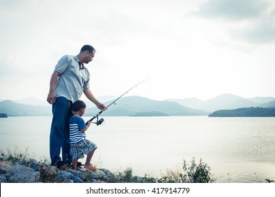 Son And Dad Fishing At Dam,vintage Tone