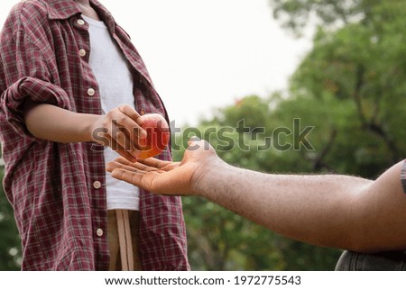 Similar – Image, Stock Photo Hand with a gift on pink background with copy space