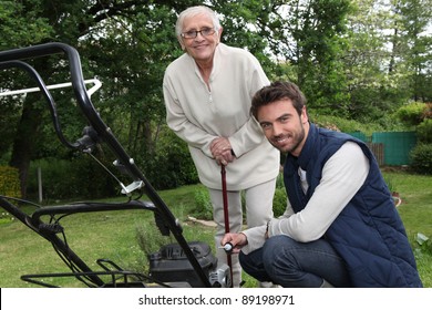 Son Helping Mother In The Garden