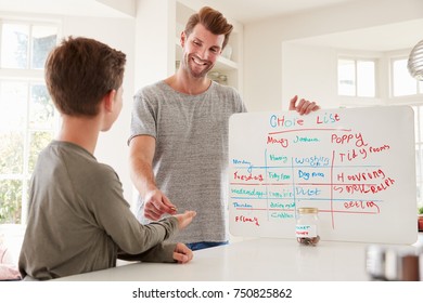 Son Receiving Pocket Money After Completing List Of Chores