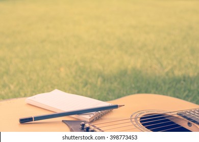 Song Writer Acoustic Guitar On Grass