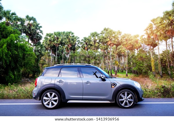 Songkhla, Thailand -\
April 13, 2019 : MINI COOPER Countryman on New model sports car\
with strong. Driving cars on the road with confidence, high\
efficiency with modern\
design