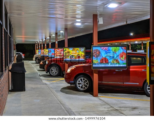 Sonic\
restaurant customers line up for menu ordering car hop service,\
Lynnfield Massachusetts USA, September 7,\
2019