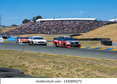 SONOMA, CALIFORNIA - JUNE 23, 2019: Racecars In Turn 8 At The Toyota/Save Mart 350 At Sonoma Raceway. Martin Truex, Jr., Won The Race, Holding Off Kyle Busch In The Last Laps.