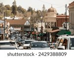 Sonora, California, USA - April 18, 2023: Afternoon traffic crowds Highway 49 through historic downtown Sonora.