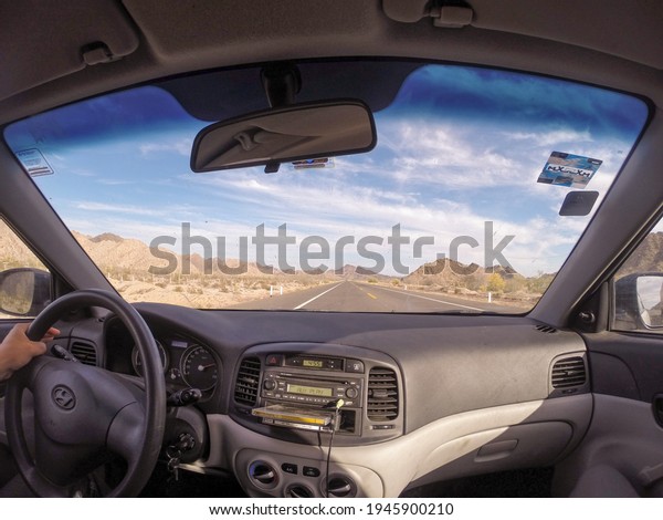 Sonora, Mexico – July 21,\
2016: Road trip interior of the car looking at the road with an eye\
fish lens