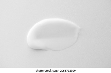 Soothe cream lotion moisturiser smear on rough white background, vertical. Skincare and body beauty product. Shampoo or hair conditioner smudge - Shutterstock ID 2055732929