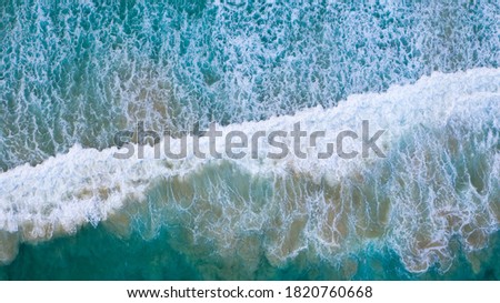 Similar – Aerial Panoramic Drone View Of Blue Ocean Waves Crushing On Sandy Beach in Portugal