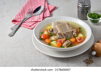 Sop Iga Sapi or Beef Rib Soup, Made from Beef Rib, tomato, carrots, potato and beef broth. Has a refreshing taste, usually served during cold weather or Eid Al Adha moment. - Shutterstock ID 2178600407