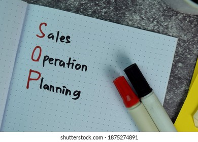 SOP - Sales Operation Planning Write On A Book On The Table. Business Concept. Selective Focus On SOP - Sales Operation Planning Text