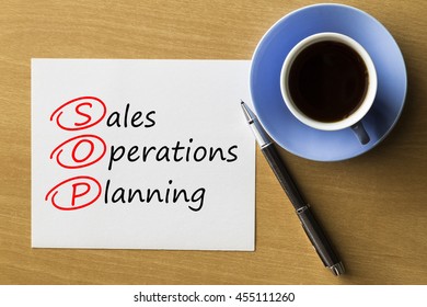 SOP Sales And Operations Planning - Handwriting On Paper With Cup Of Coffee And Pen, Acronym Business Concept 
