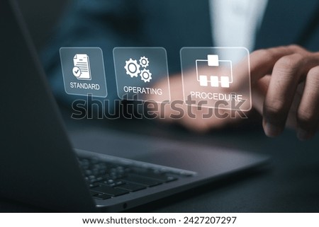 SOP, Standard operating procedure concept. Businessman use laptop with virtual SOP icons for the standard operating procedure with instruction, quality, process, operation, sequence, workflow.