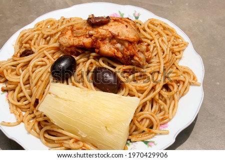 Sopa Seca is a traditional Peruvian dish cooked with noodles, chicken yuca and black olives. Typical food from Ica region served with spaghetti.