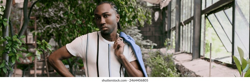 Sophisticated man in dapper style stands before a painting of a house in a vivid green garden. - Powered by Shutterstock