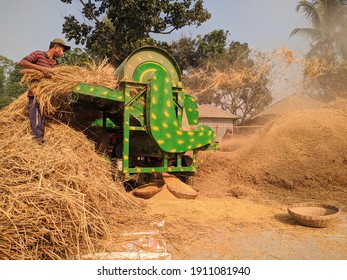Sophisticated rice threshing machine in Bangladesh.Agricultural equipment.Modernization of agriculture.Agricultural development in Bangladesh concept. Rice. Paddy. Threshing. Thresher. 