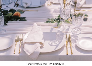 Sophisticated table setting with gold cutlery